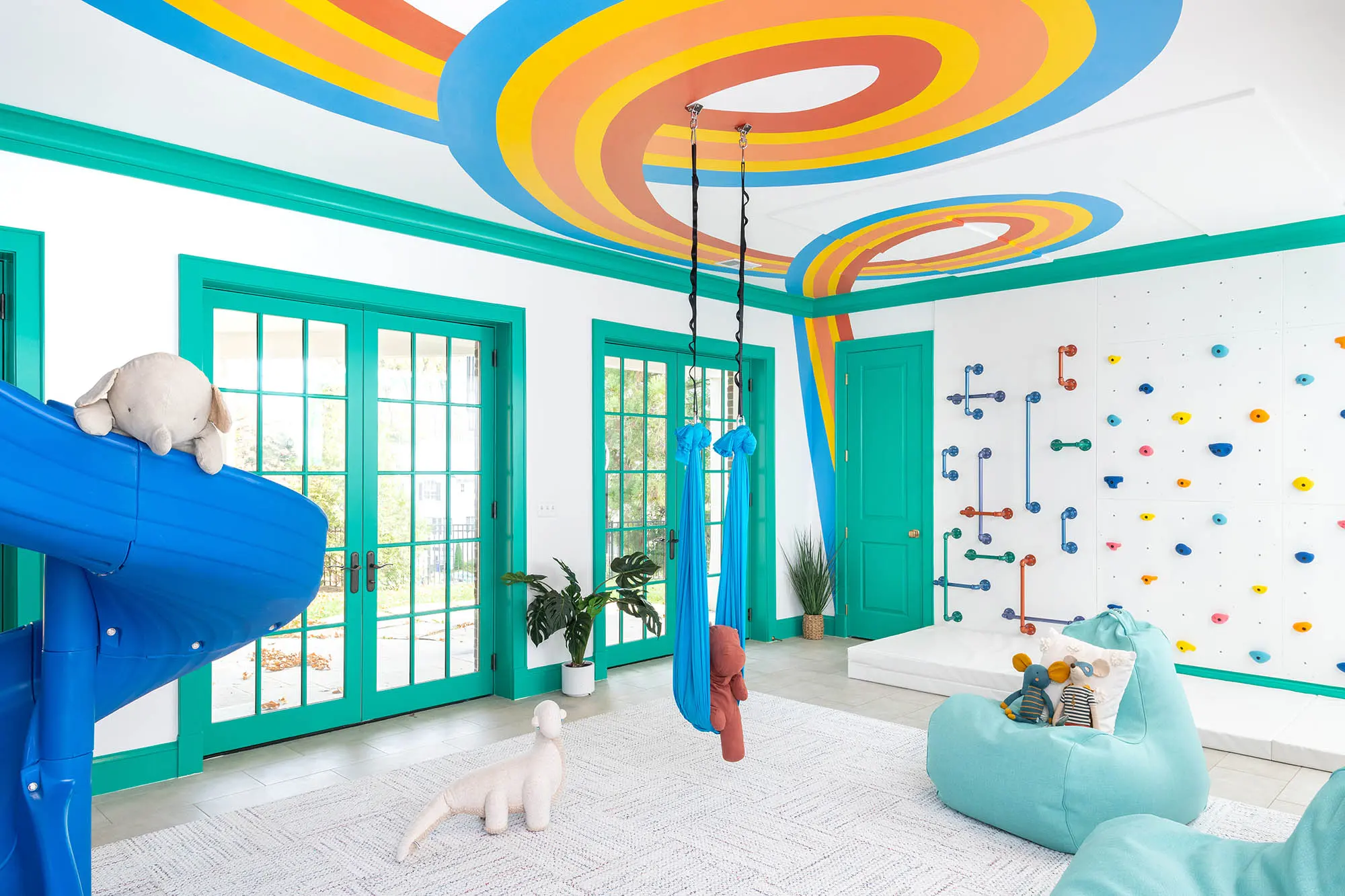 Arlington playroom with a colorful ribbon mural crossing the ceiling.