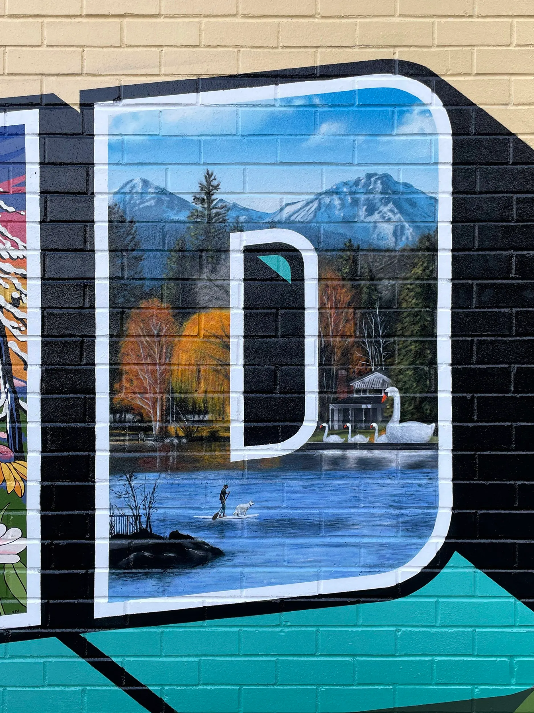 Drake Park, Mirror Pond, and the Three Sisters painted inside the letter D