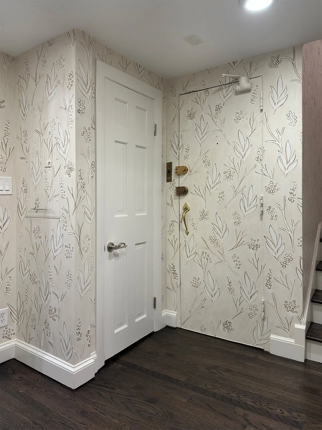 Hand-painted botanical pattern surrounding the front door of the Beacon Hill residence