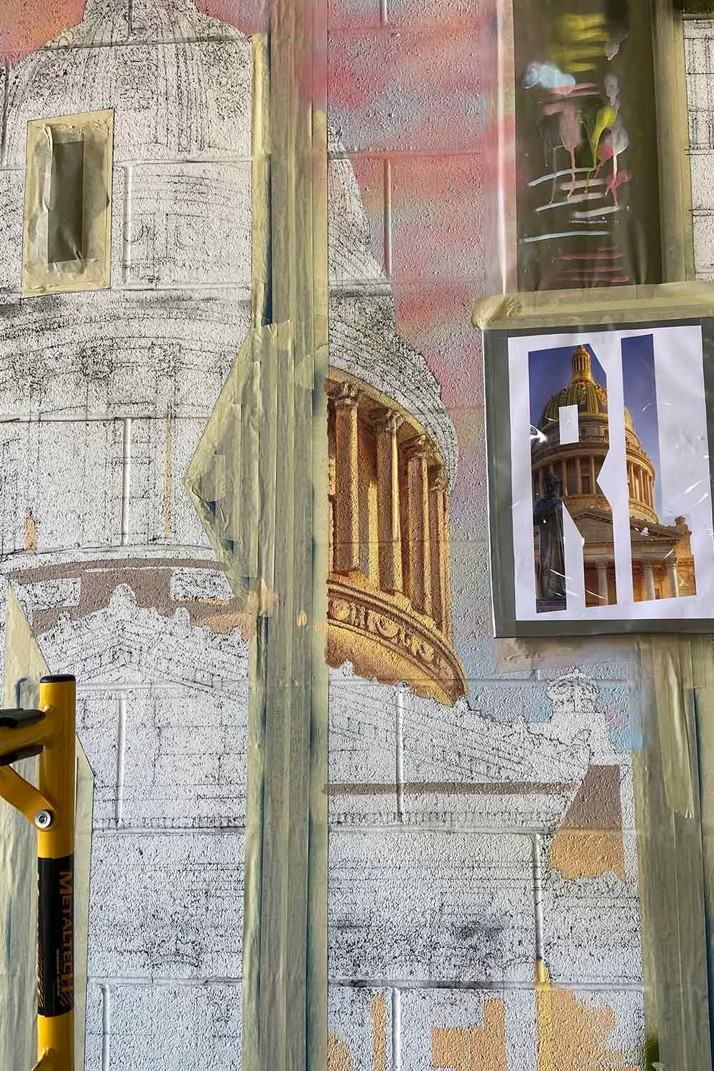 Close view of brush-painted State Capitol details in progress