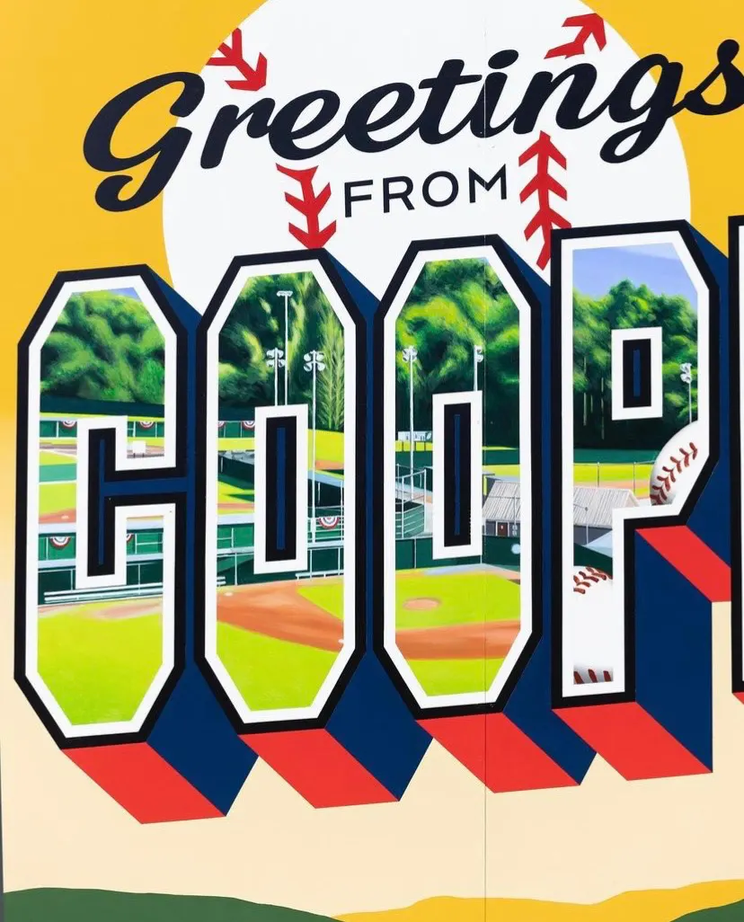 Close view of baseball scenes painted inside the Cooperstown letters
