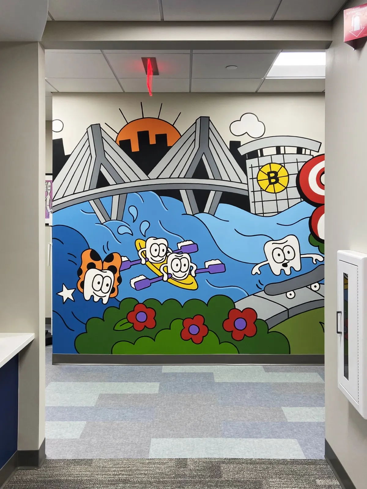 Tooth characters kayaking and skateboarding beside the Charles River, Zakim Bridge, and TD Garden in the Quincy dental mural