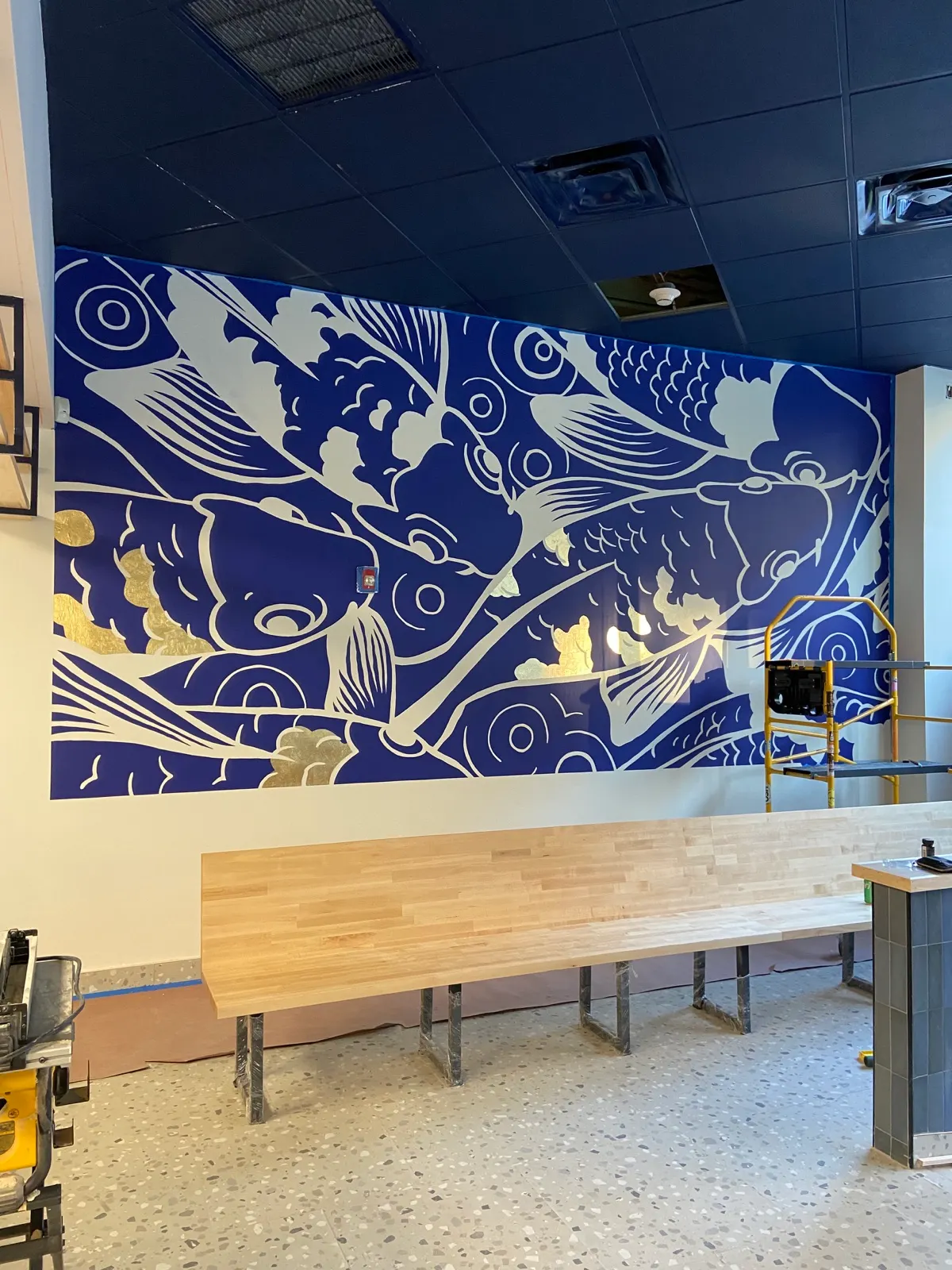 Kenzoku koi mural after gold leaf was applied to selected scales and water shapes