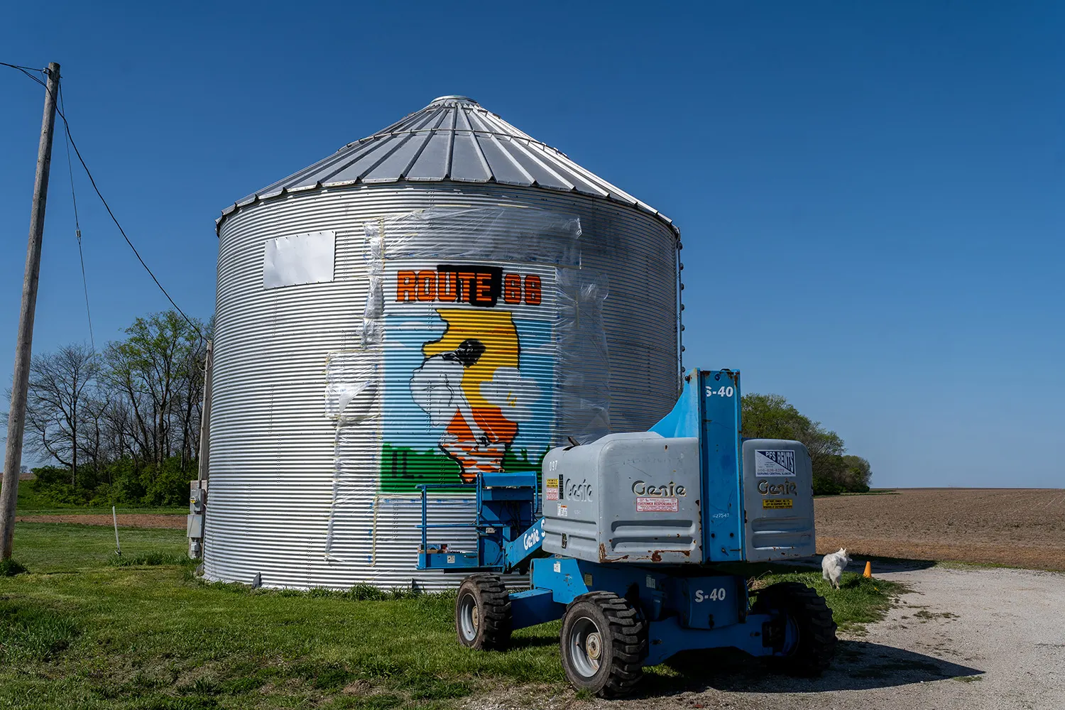 Boom lift beside the completed Route 66 silo mural