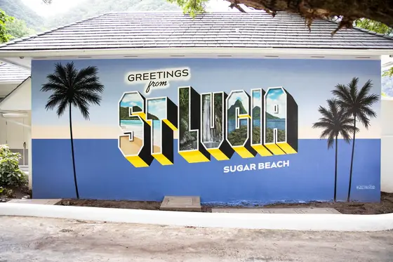 A bright destination mural that reflects the studio's capacity for hospitality and travel-market work.