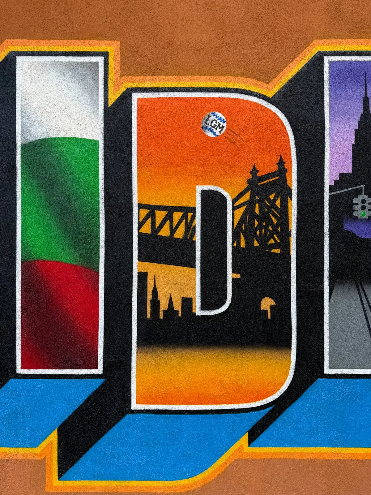 Close view of the Sunnyside lettering with the Queensboro Bridge, a baseball, and the Empire State Building silhouette