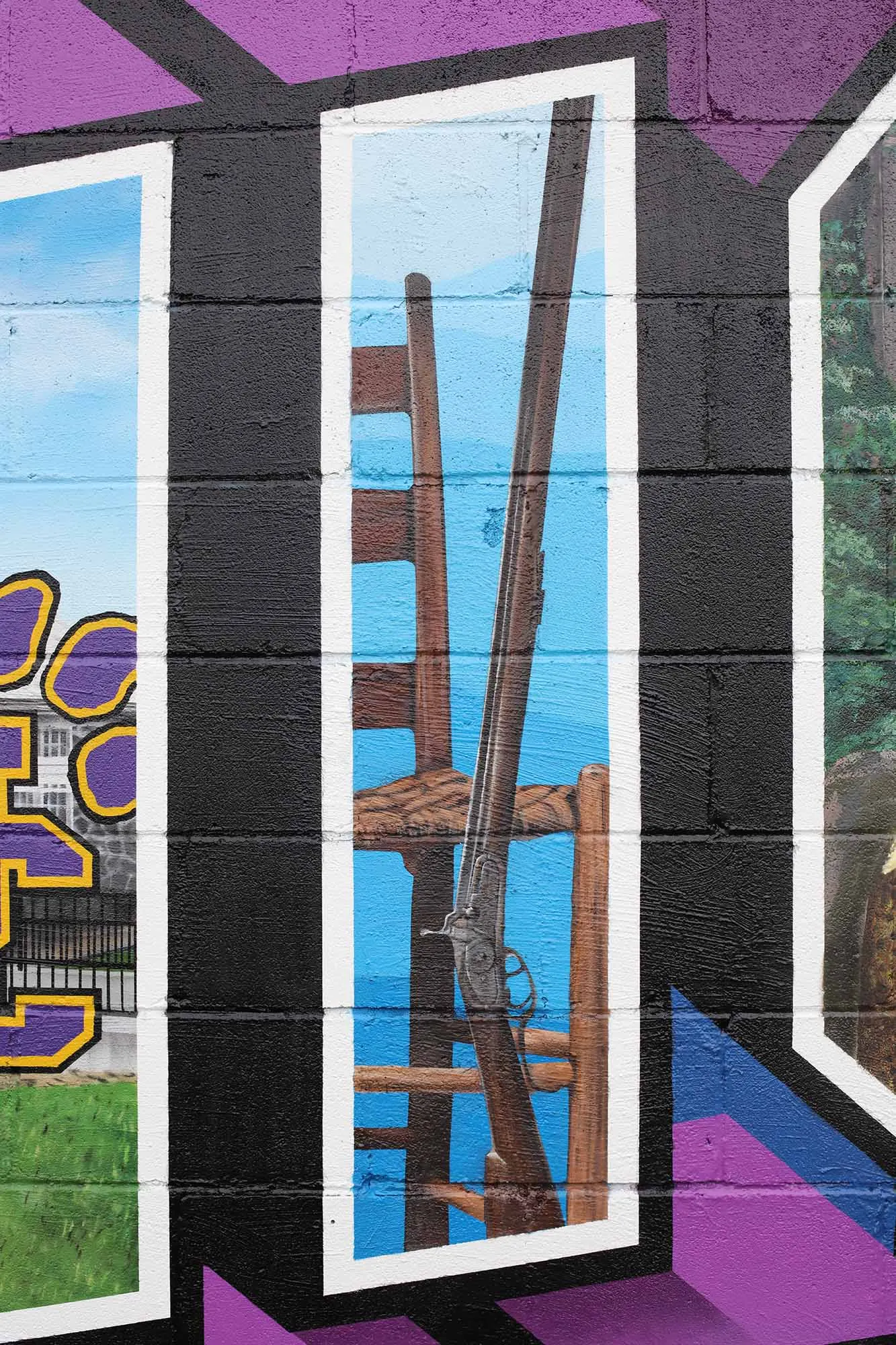 Reid-made chair and Gillespie rifle painted inside the letter I