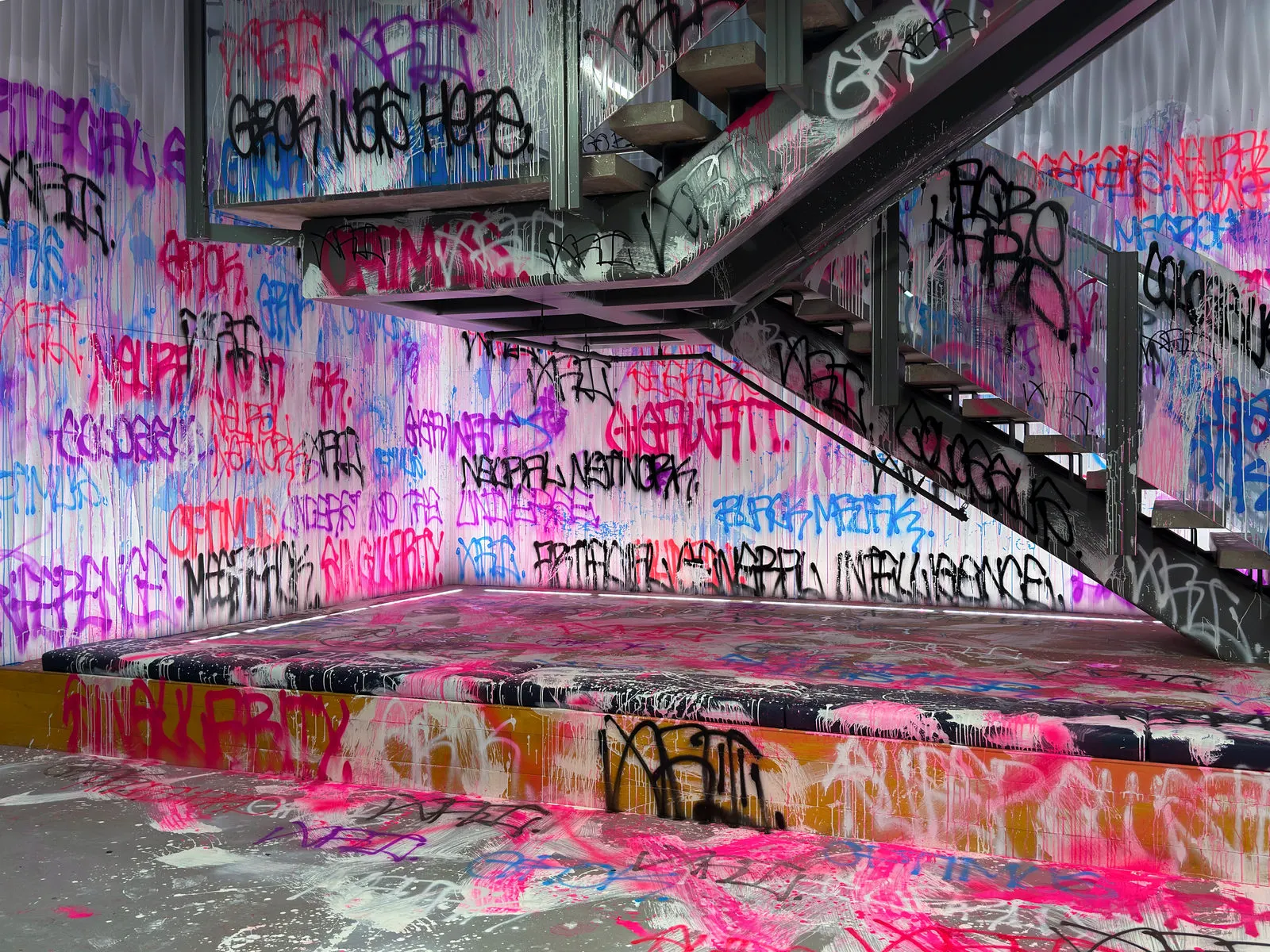 Fluorescent tags covering the stairs, landing, walls, and nearby surfaces